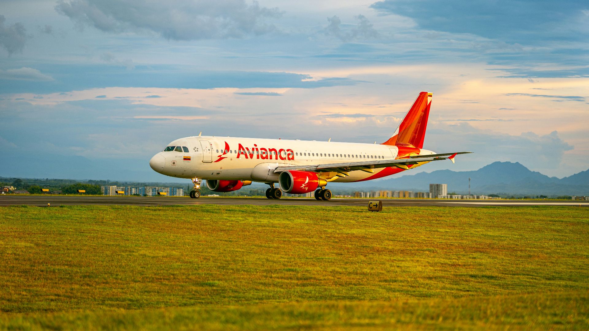 a large jetliner sitting on top of an airport runway