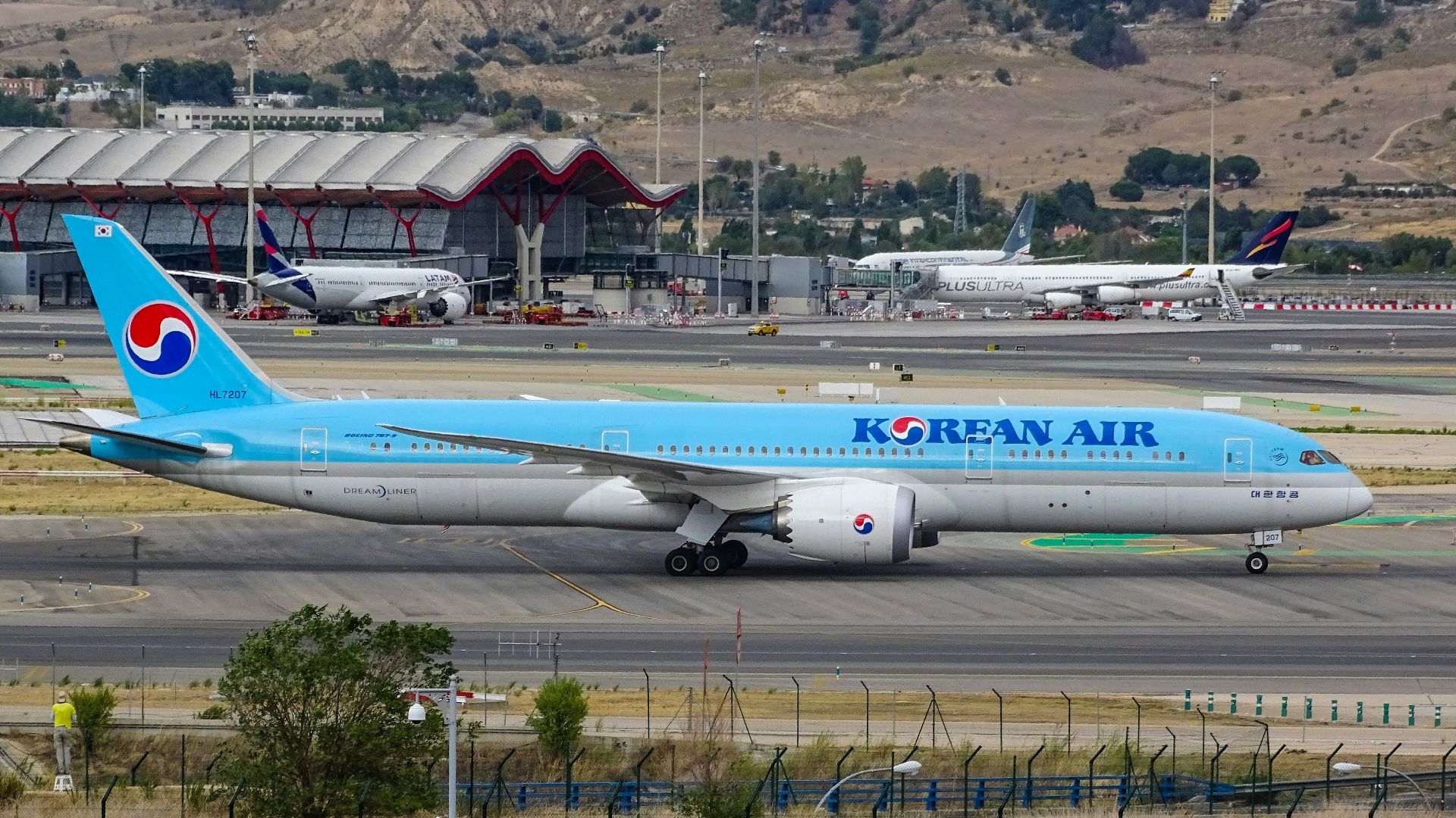 blue Korean Air airplane on runway