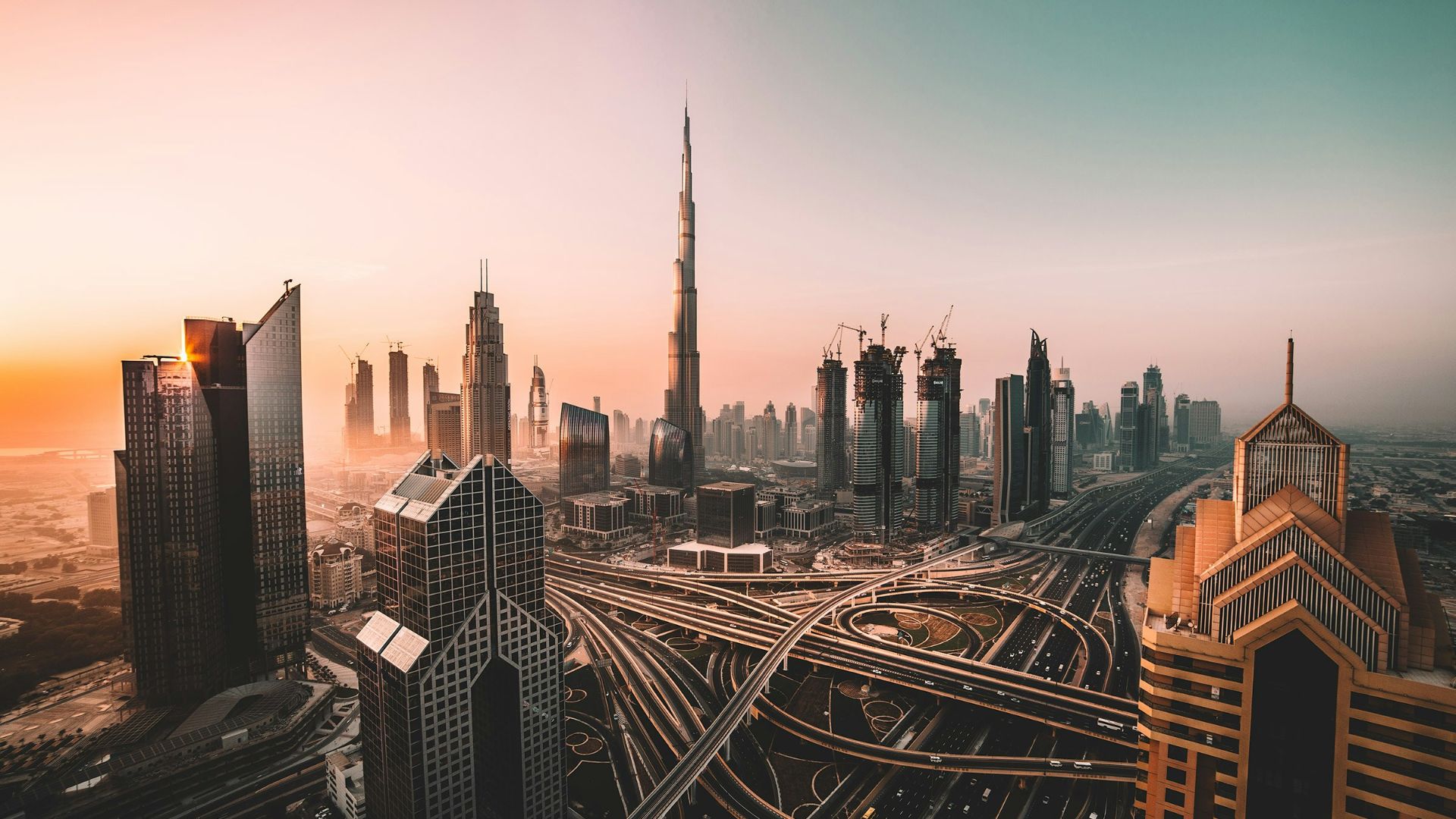 aerial photo of city highway surrounded by high-rise buildings