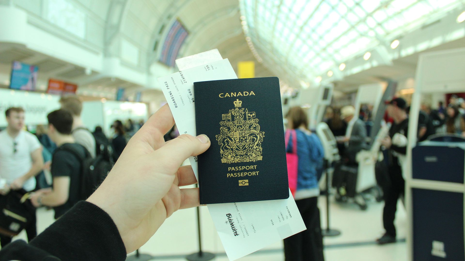 person holding Canada passport