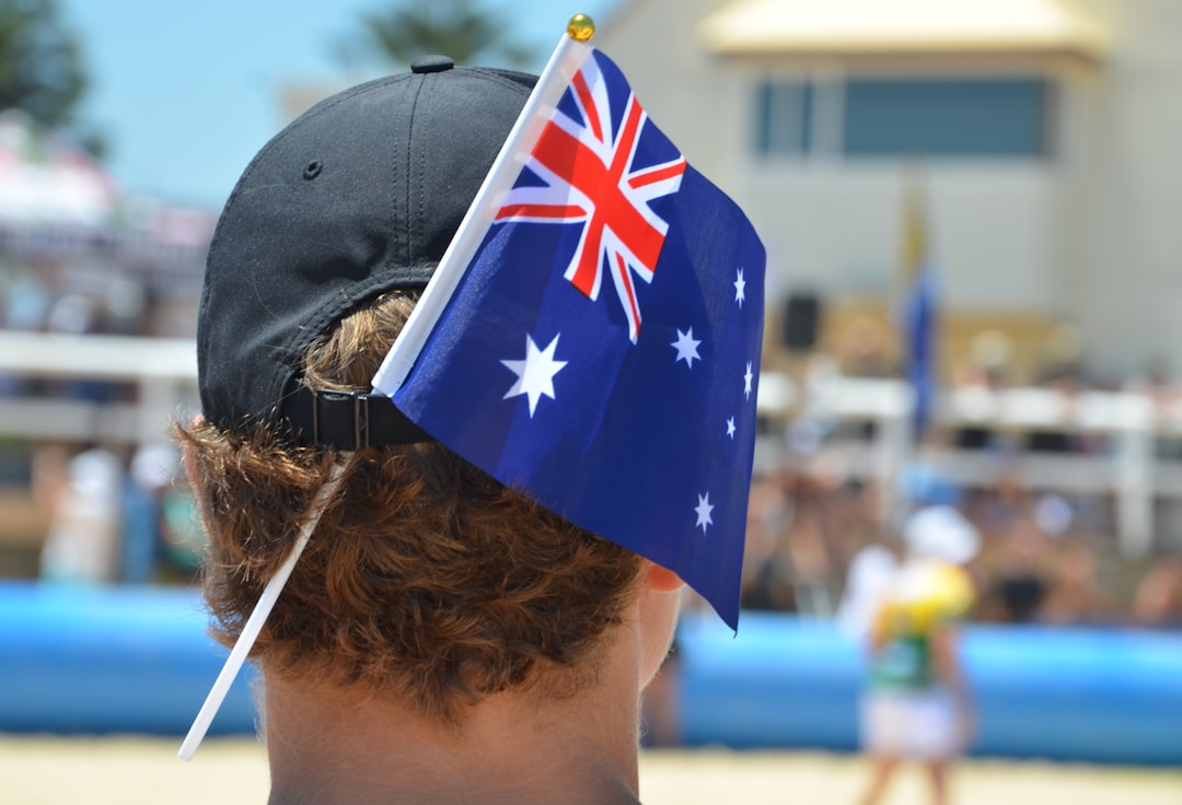 a man wearing a hat with a flag on it