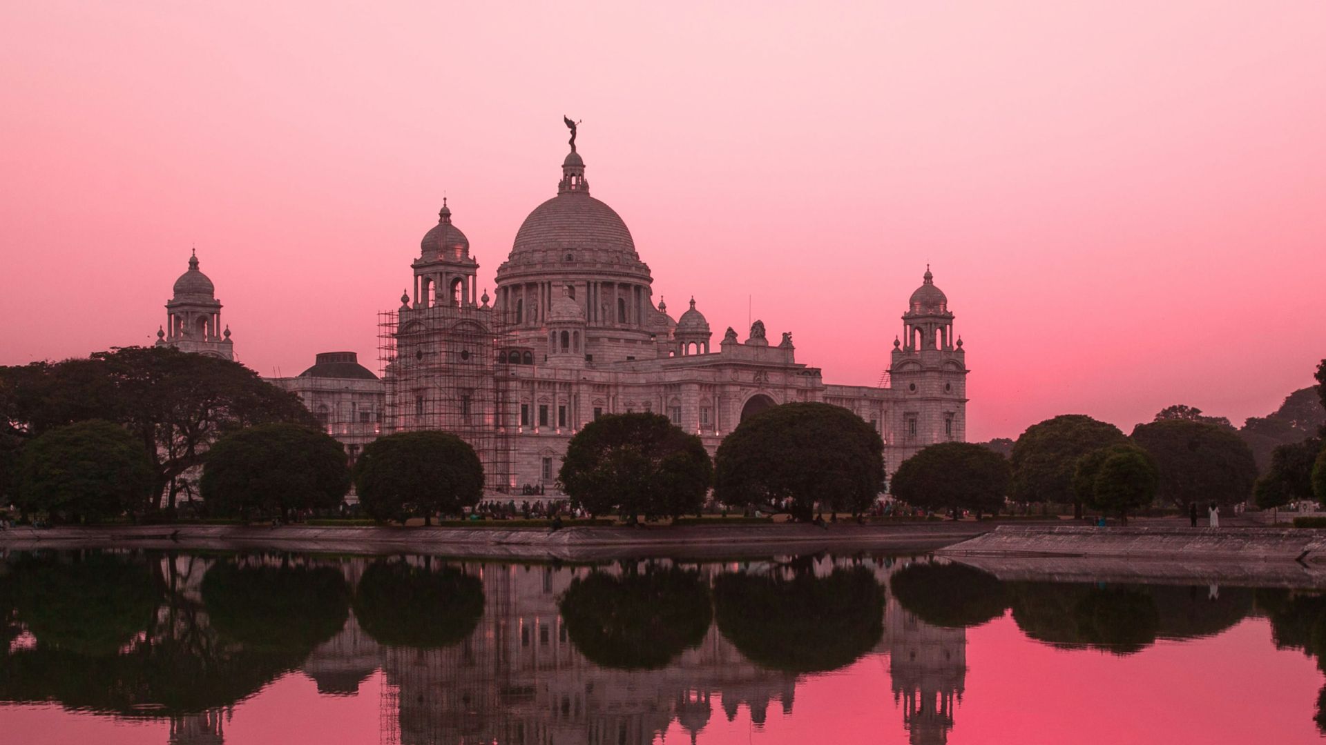 white concrete castle near body of water