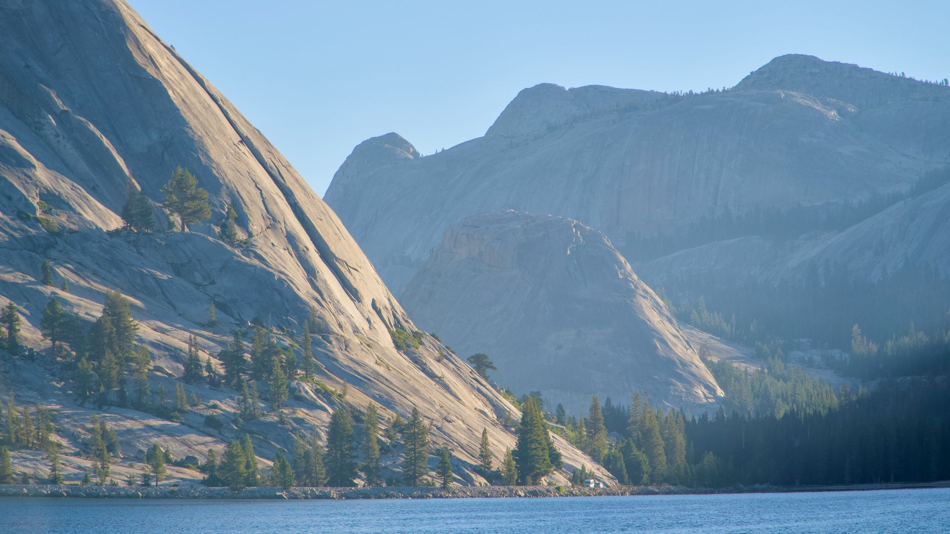 A lake with a mountain in the background