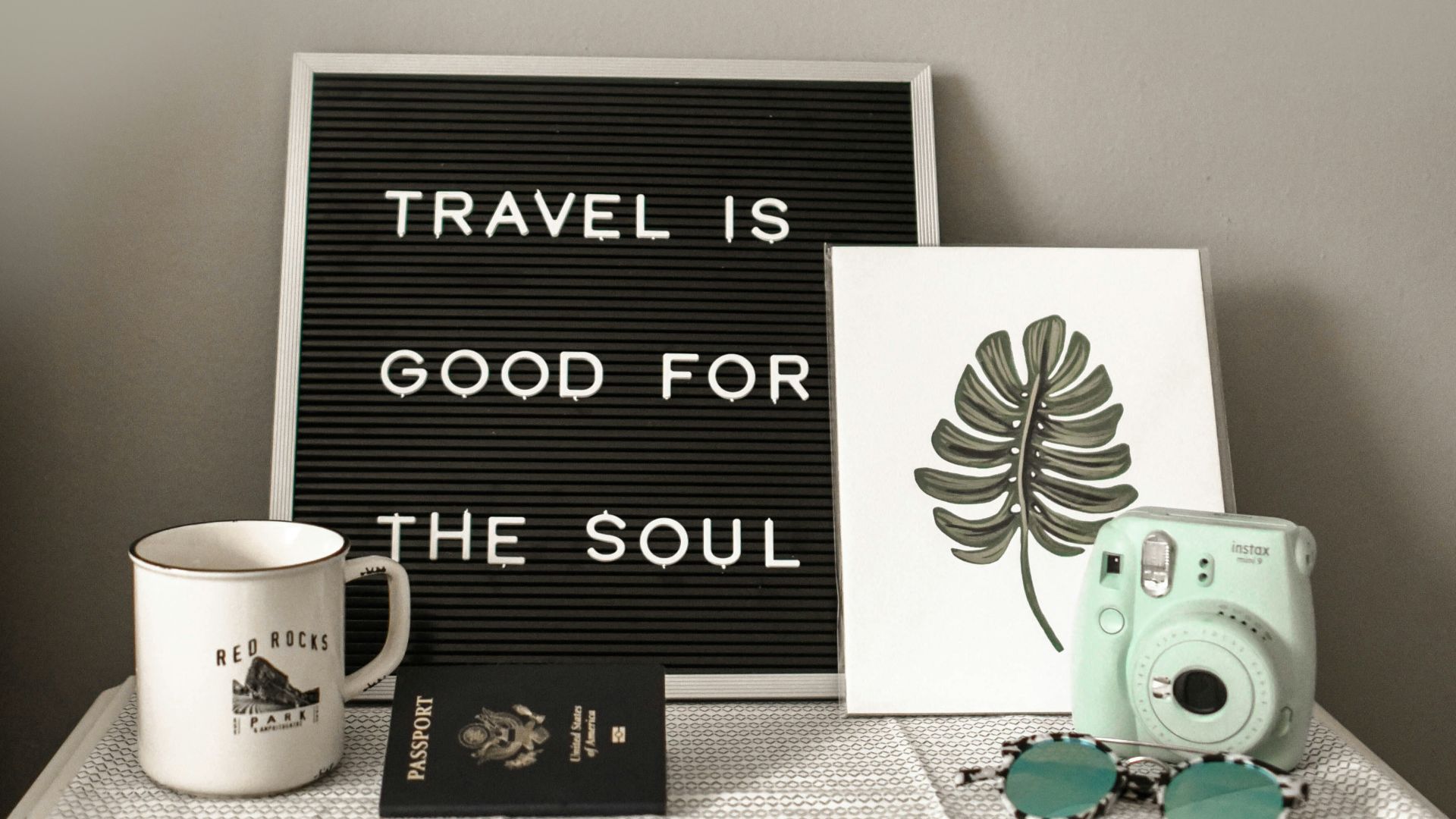 teal Instax Mini 8 instant camera near decor