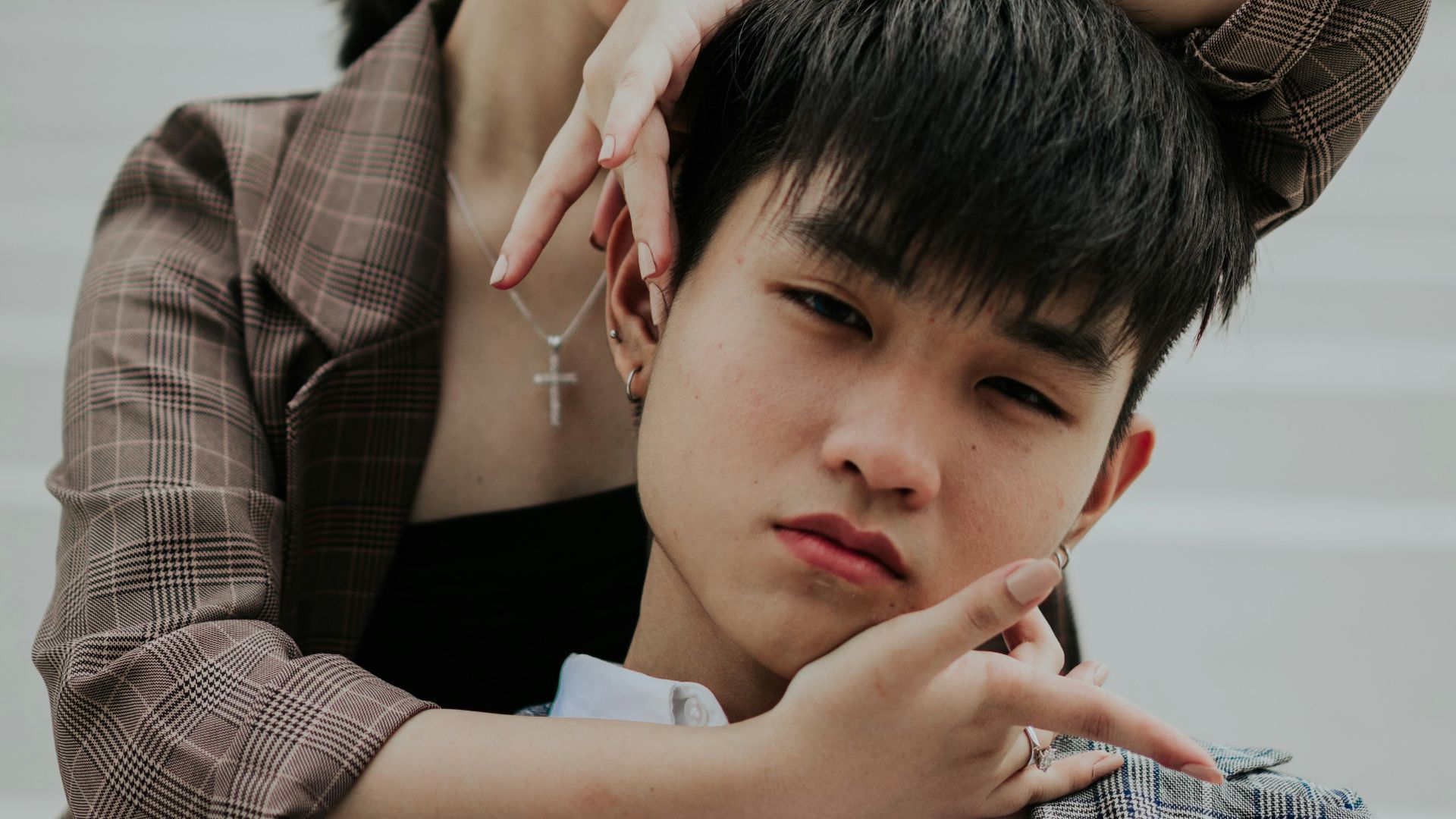 woman holding man's head