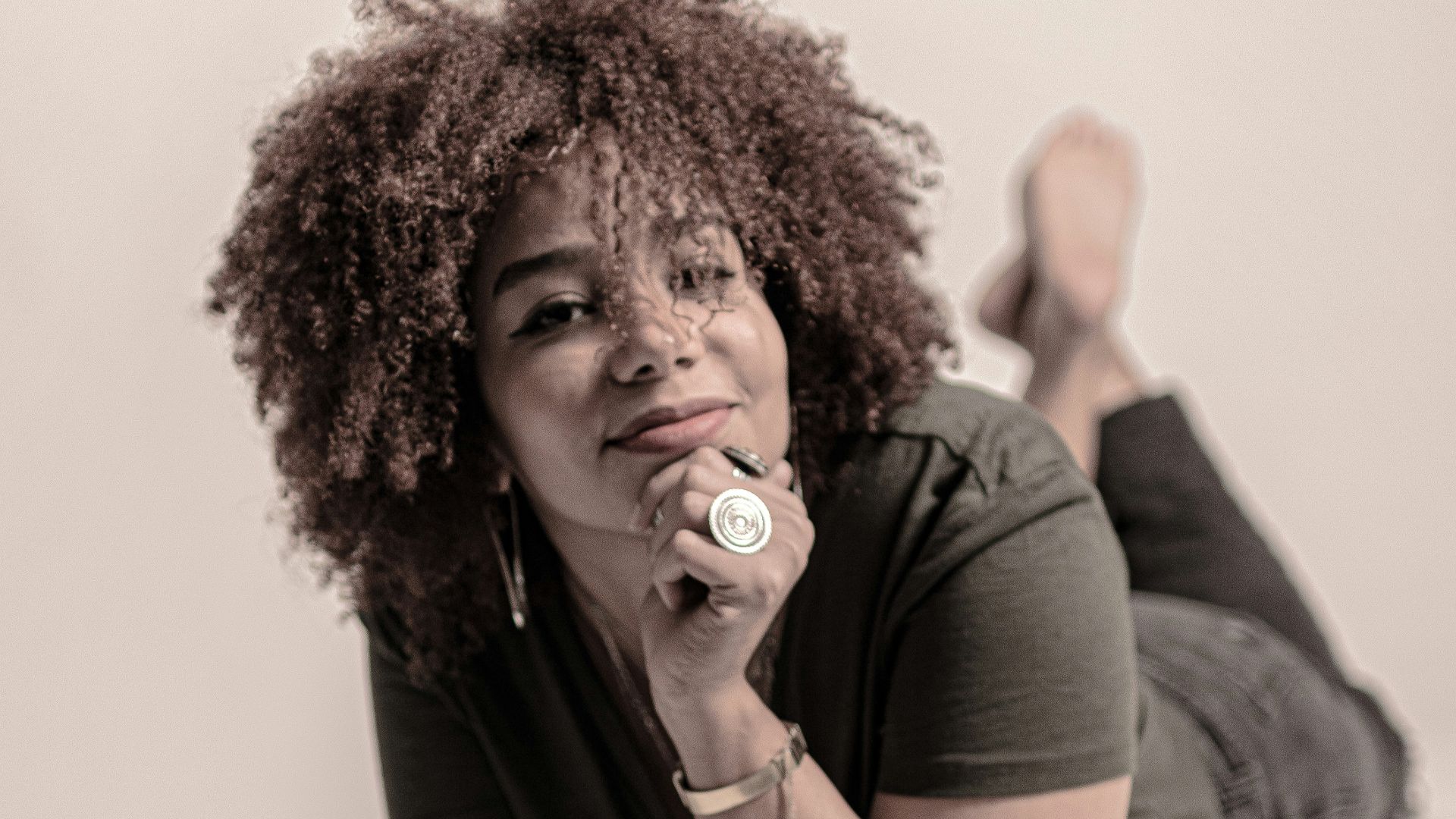 a woman with curly hair