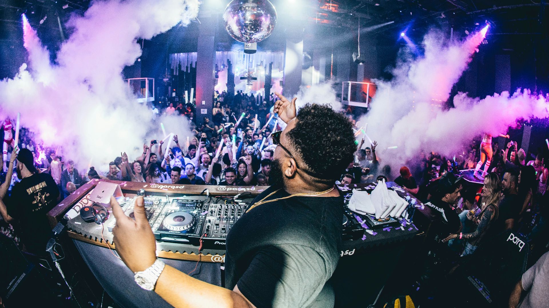 man playing DJ turntable