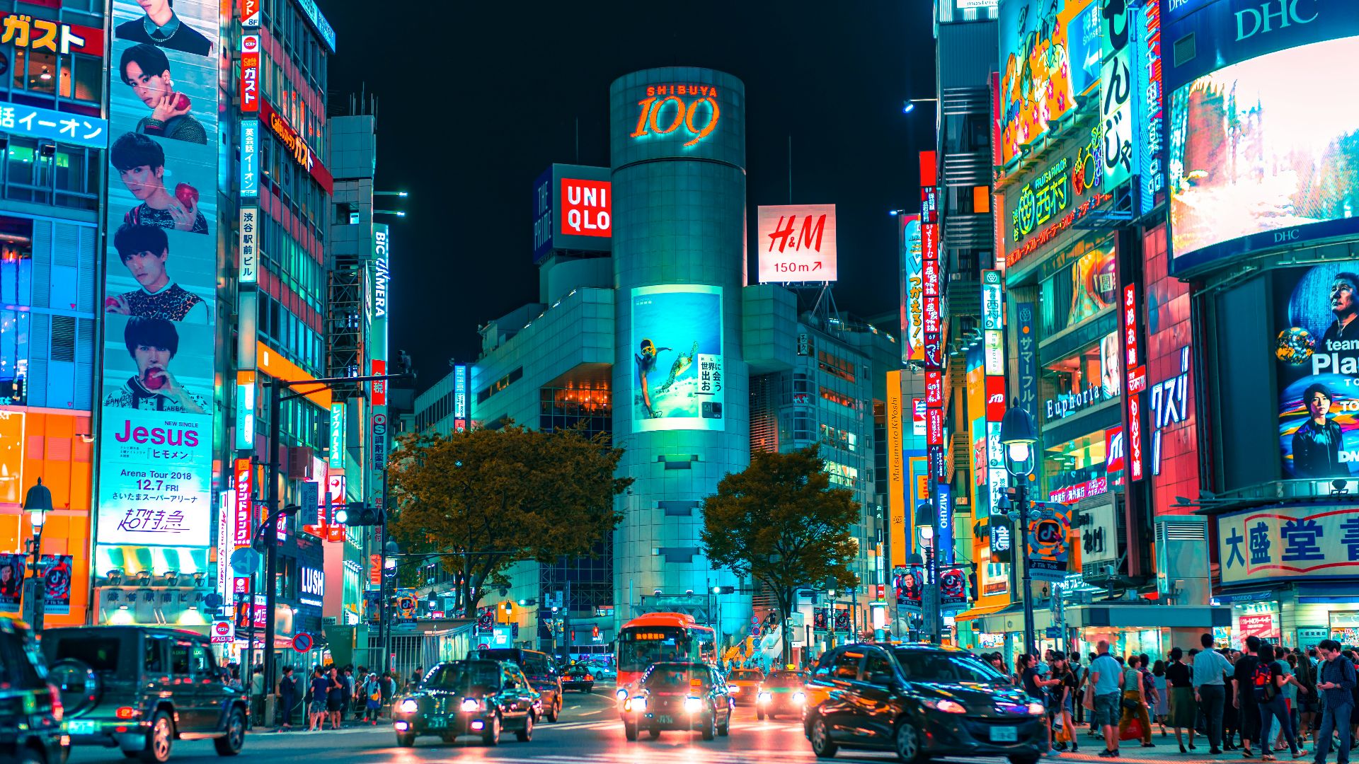 people gathered outside buildings and vehicles