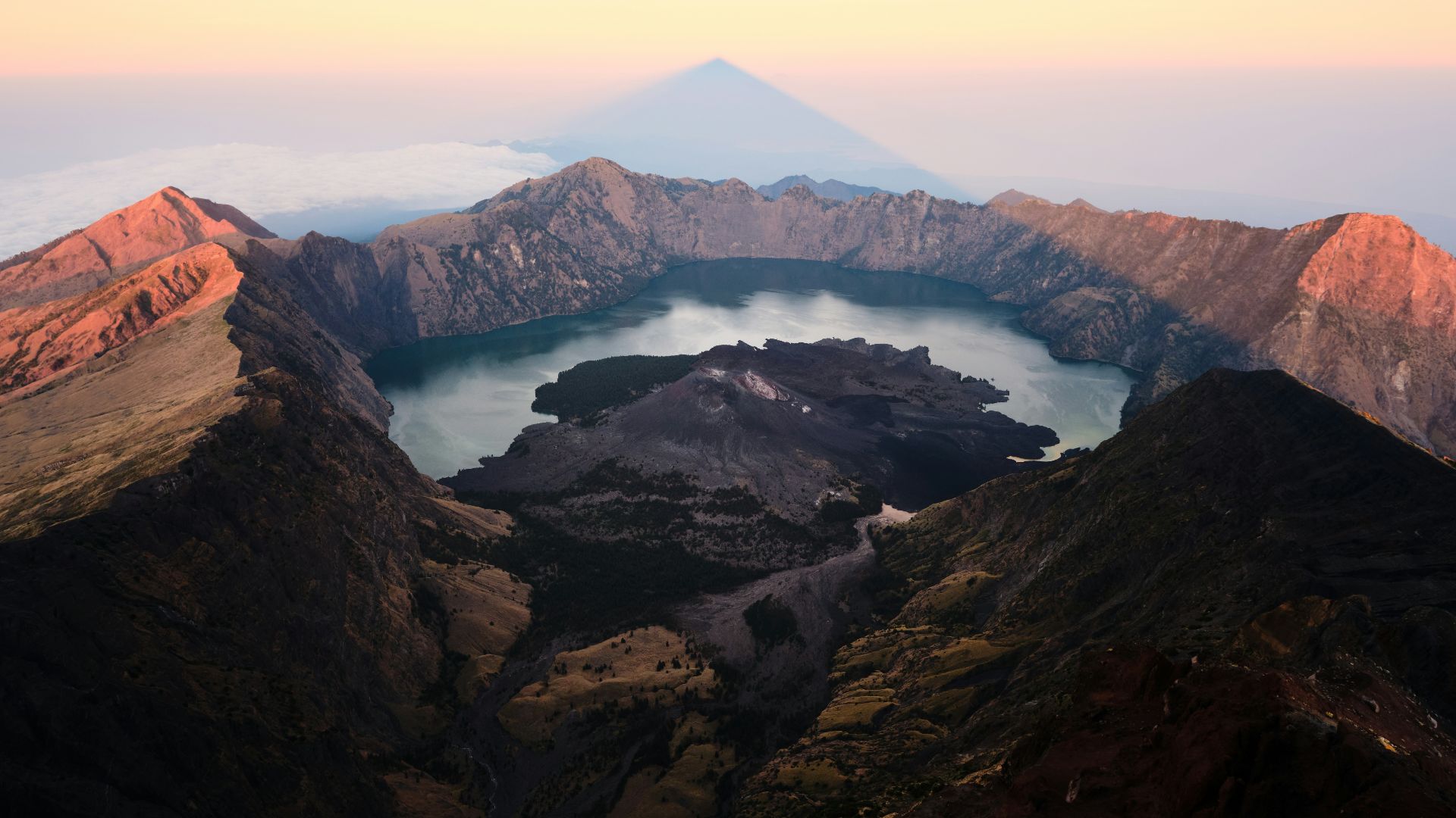 a mountain range with a lake in the middle of it