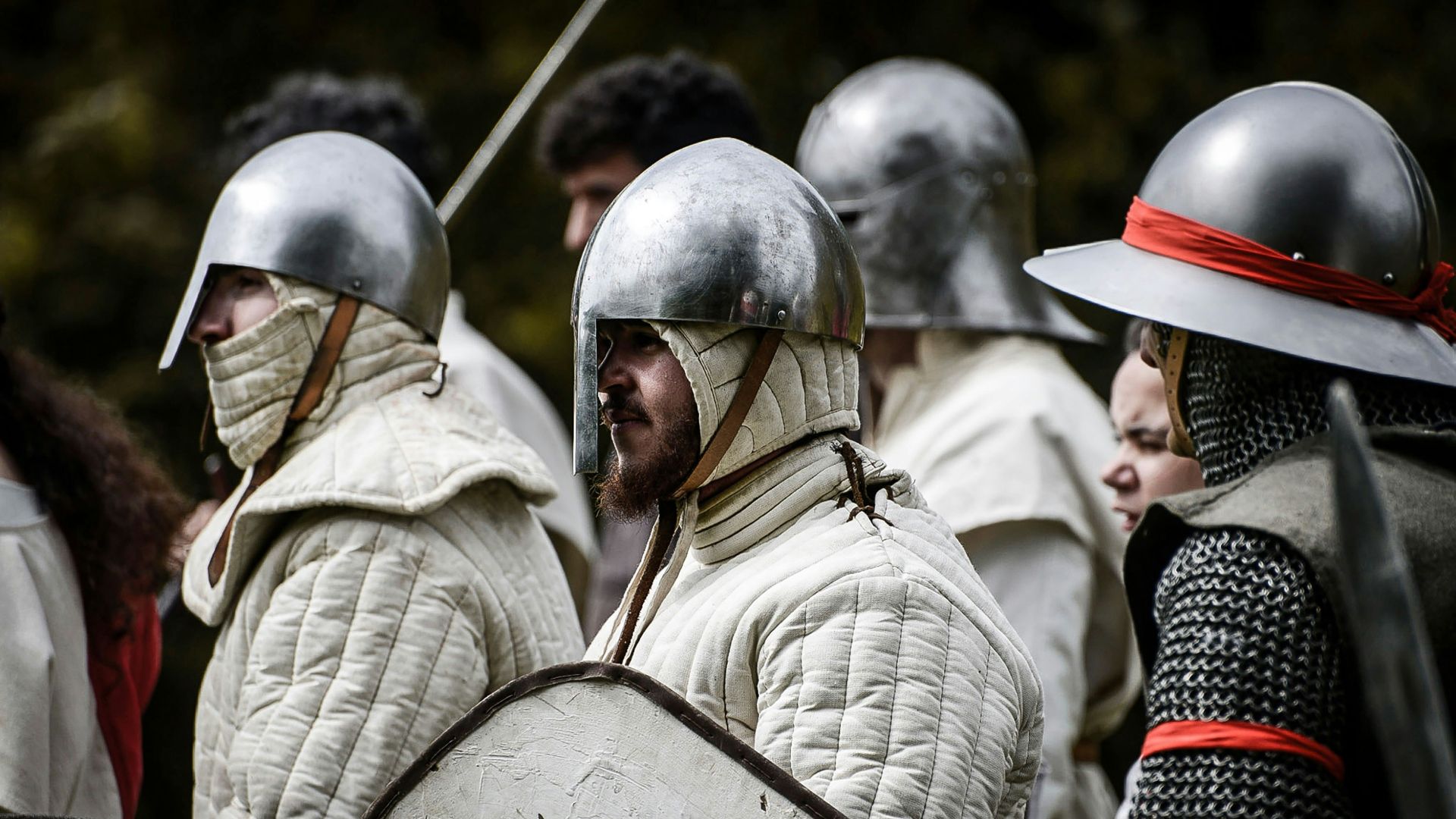 a group of men in armor standing next to each other