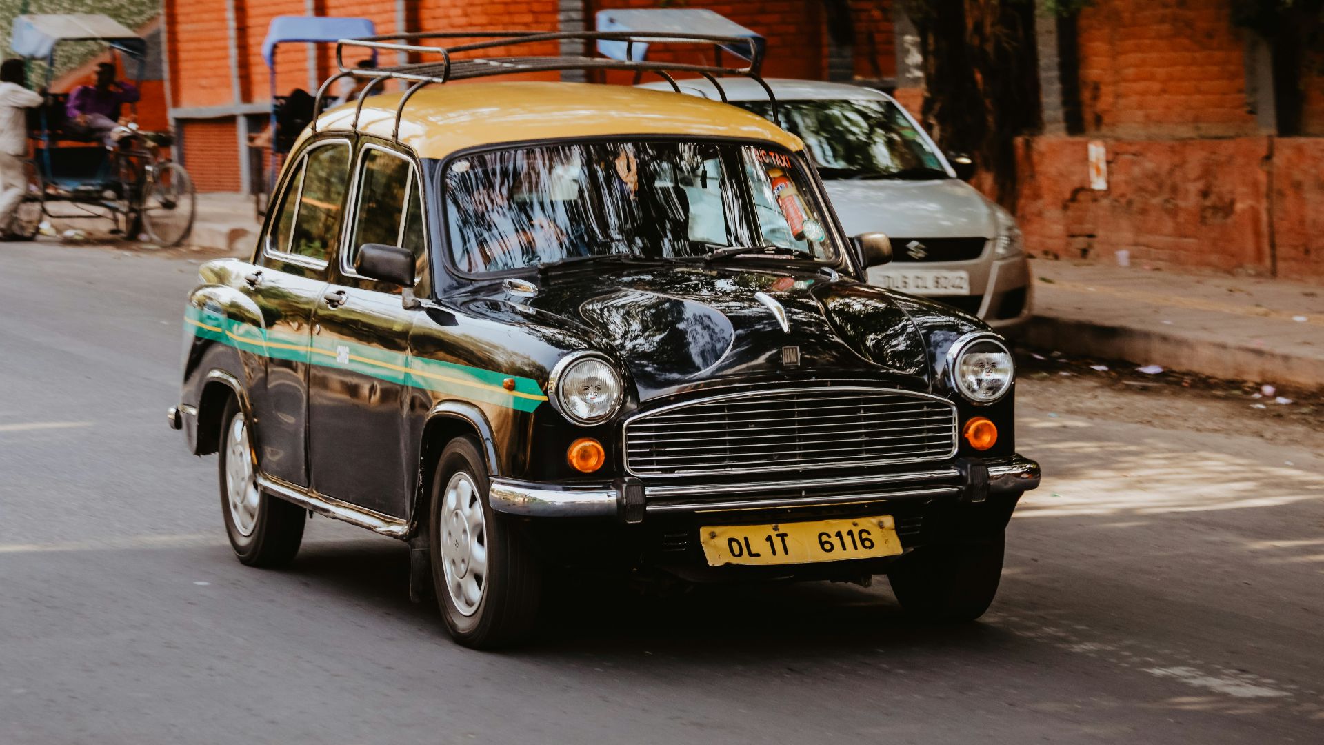 black sedan on blacktop road