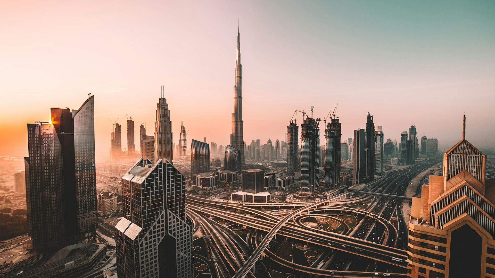 aerial photo of city highway surrounded by high-rise buildings