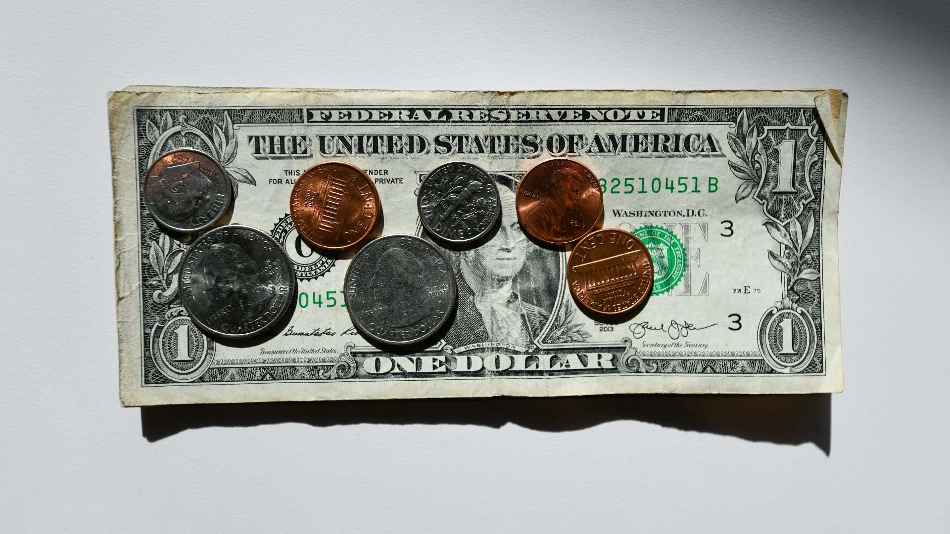 silver and gold round coins in box