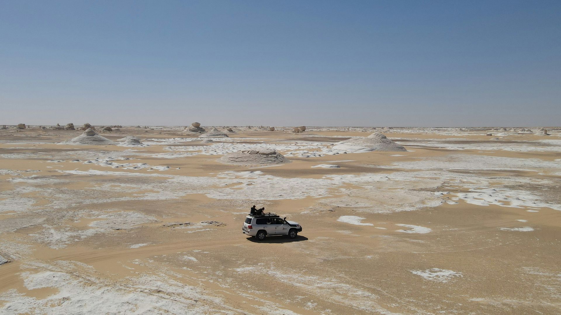 a vehicle is parked in a barren area