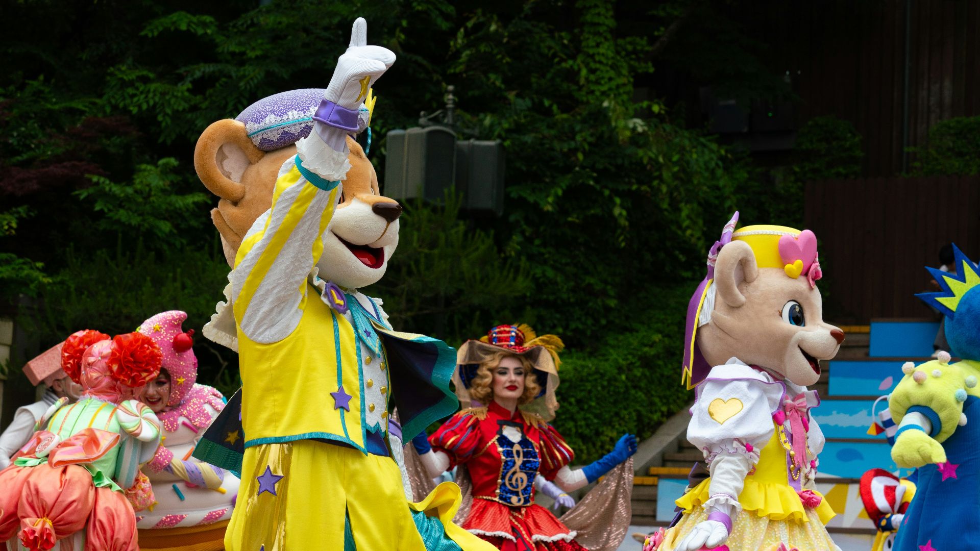 A group of people in costume dancing on a street