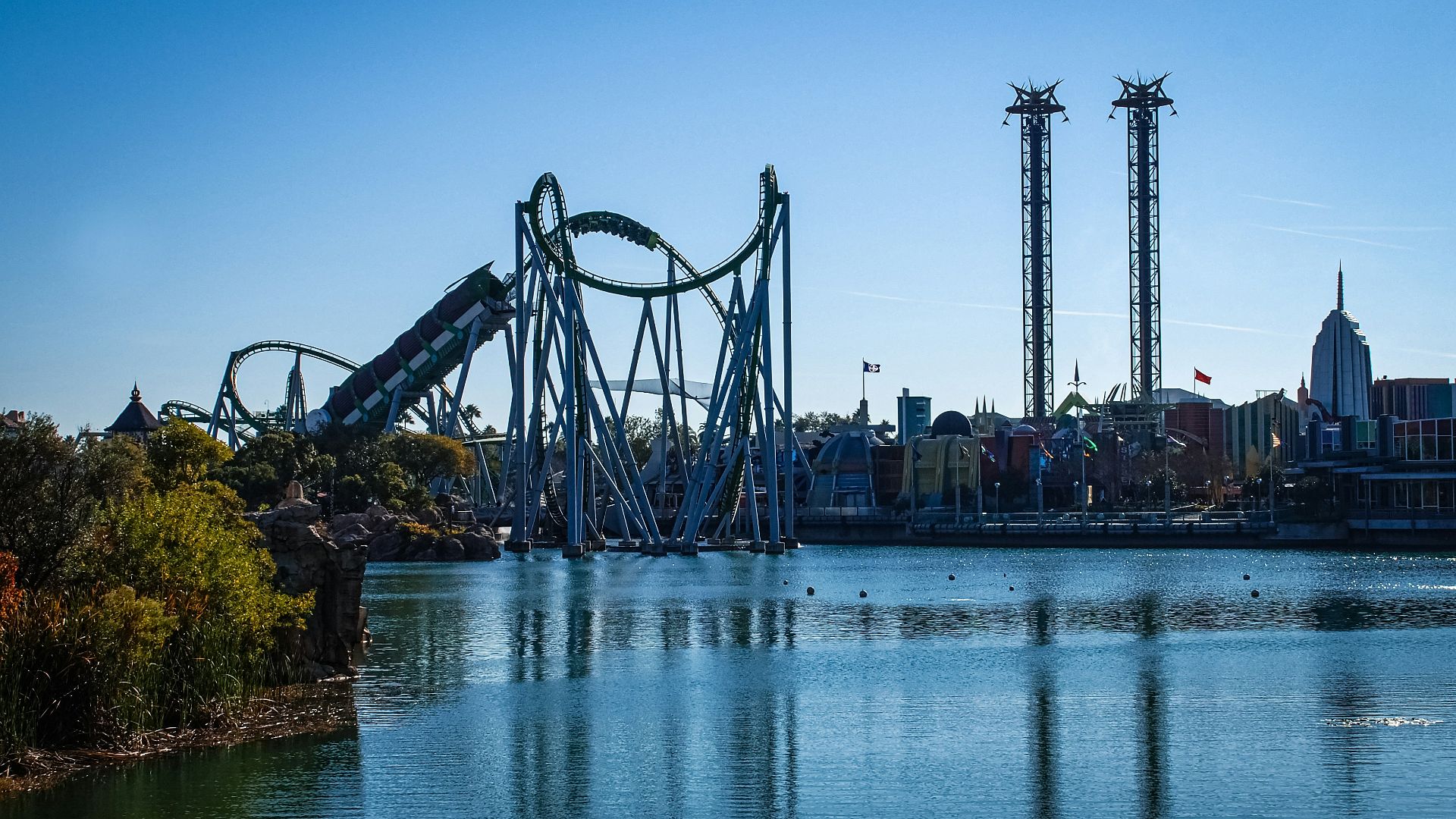 a roller coaster in the middle of a body of water