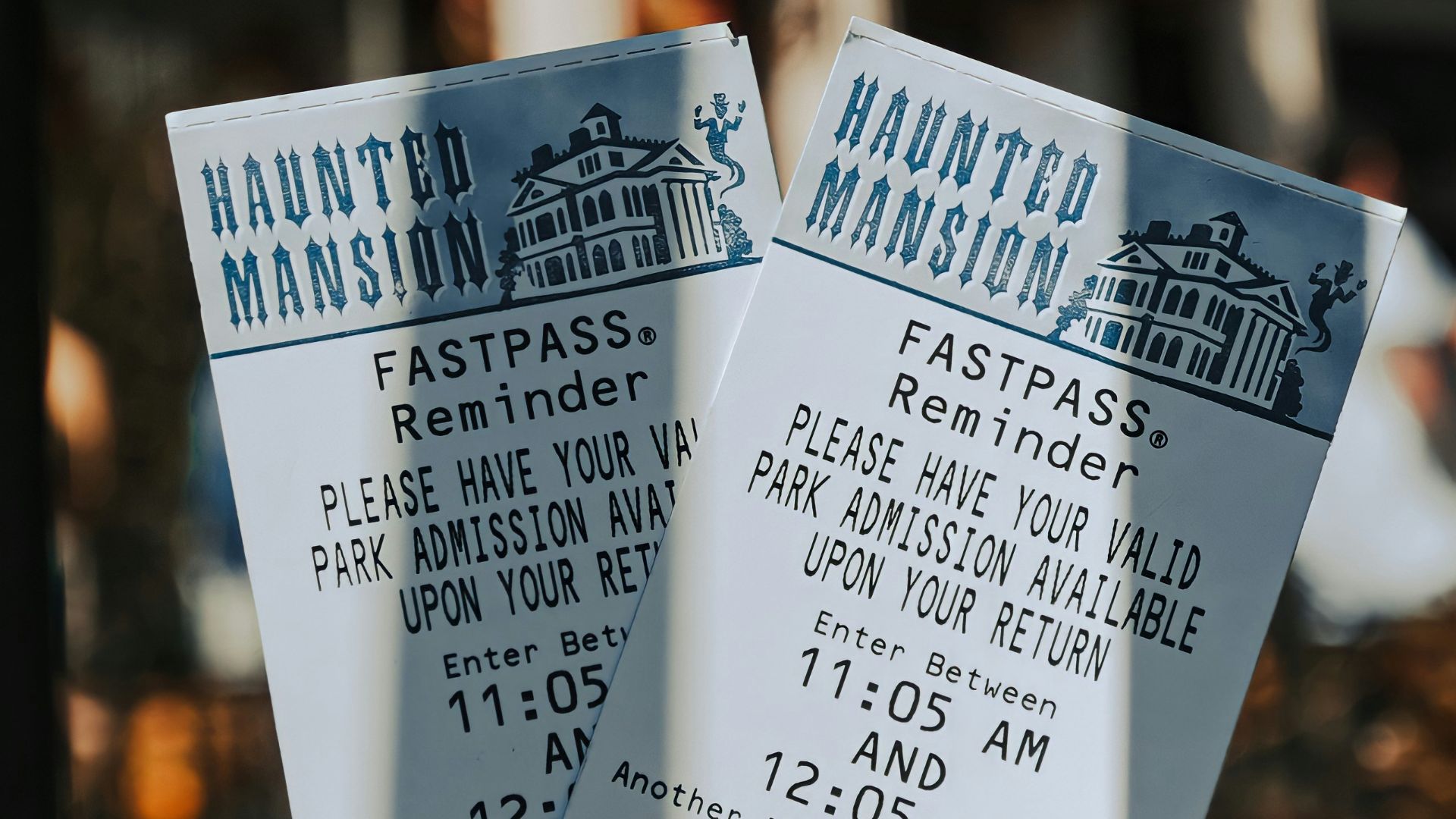 a hand holding a sign