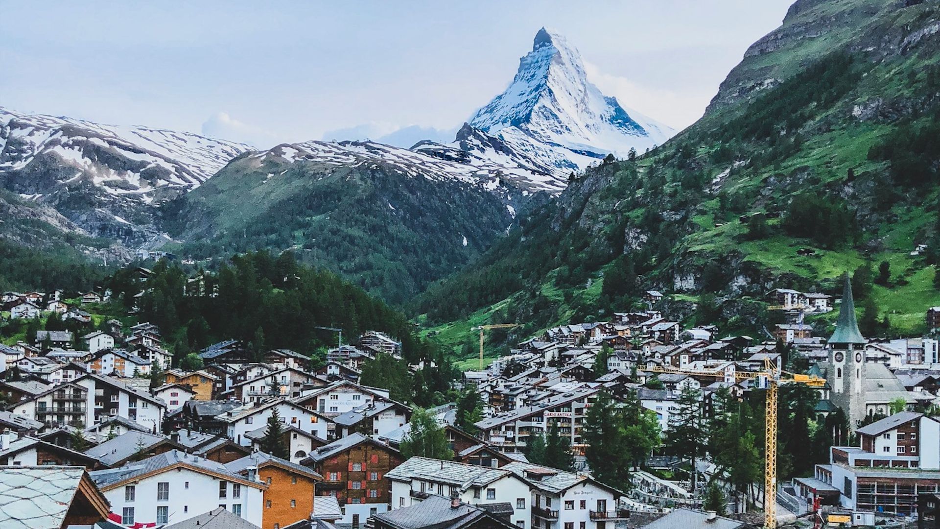 aerial photography of houses near mountains at daytime