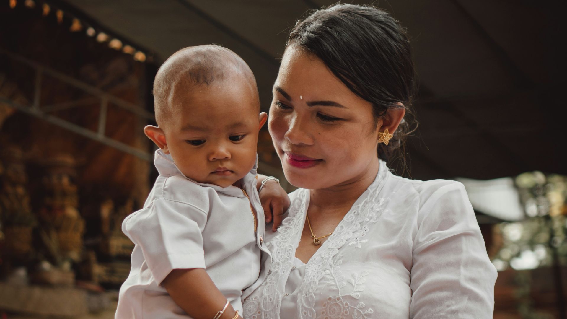 a person holding a baby