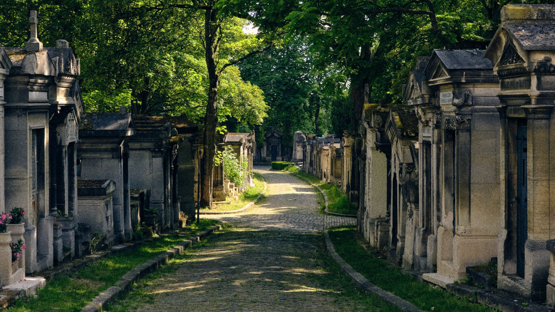 an old cemetery with a stone path leading to it