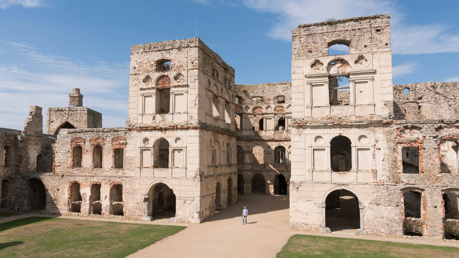beige concrete building under blue sky during daytime