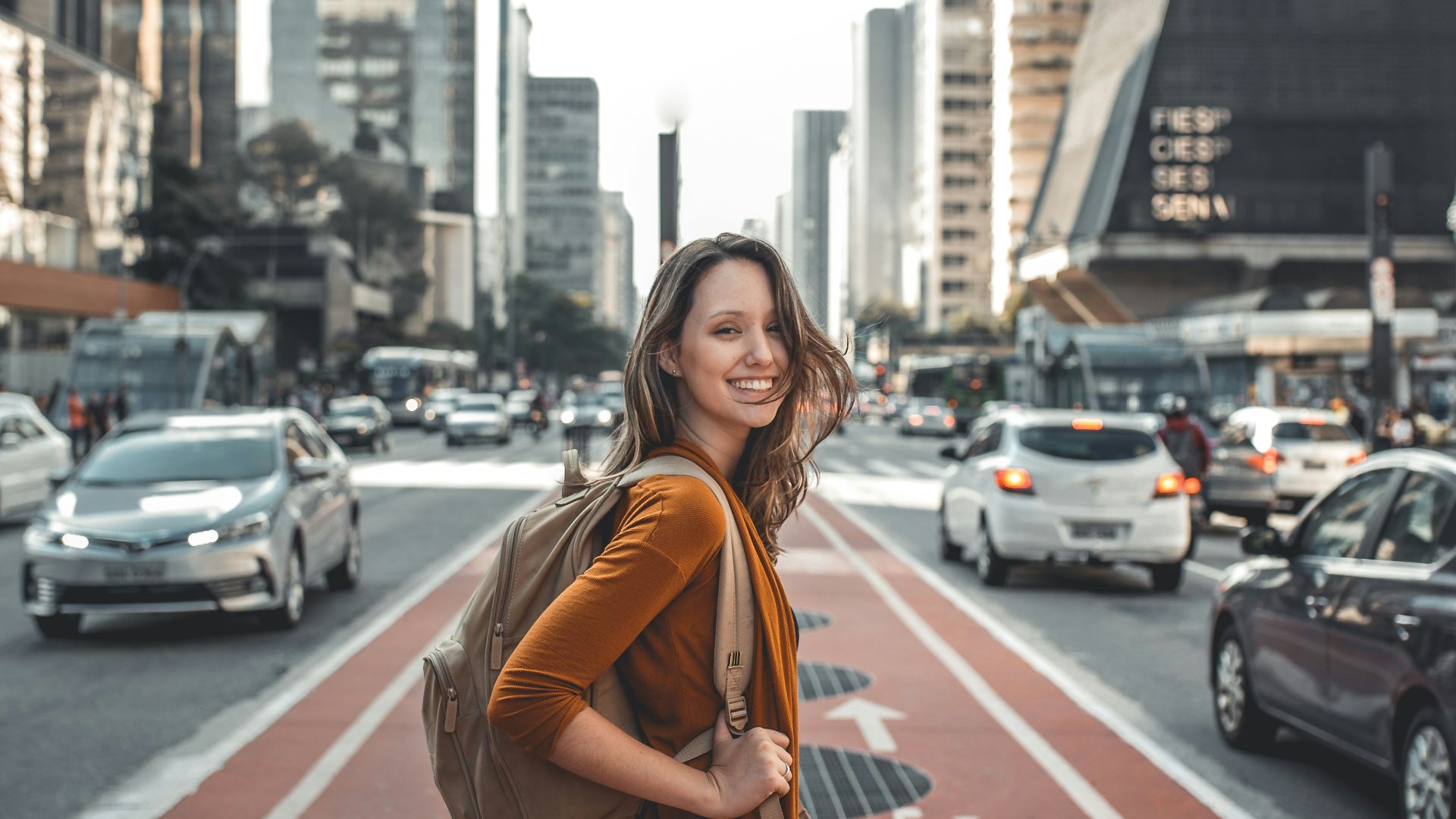 woman standing on middle of road