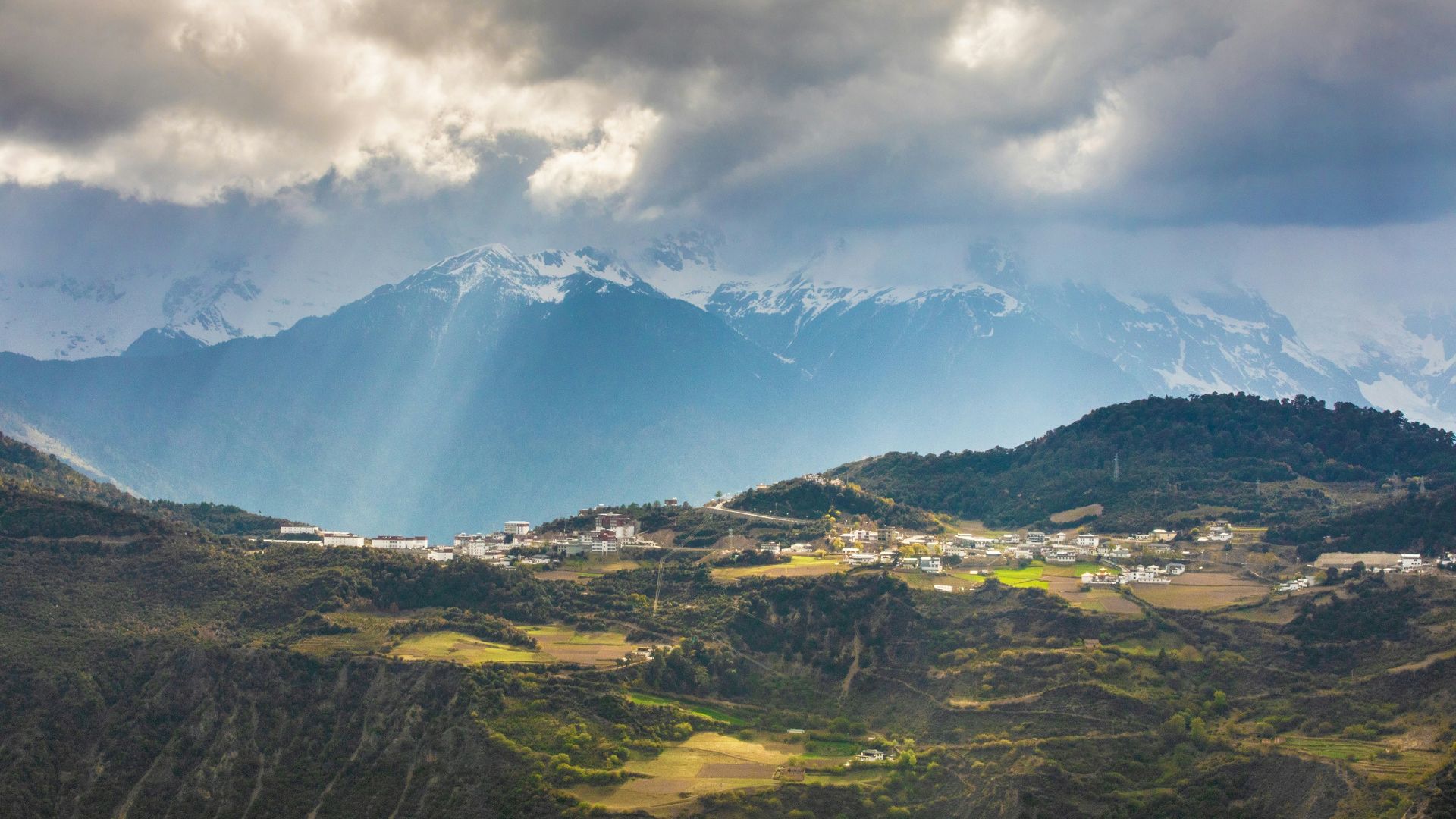 mountains under cloudy sky