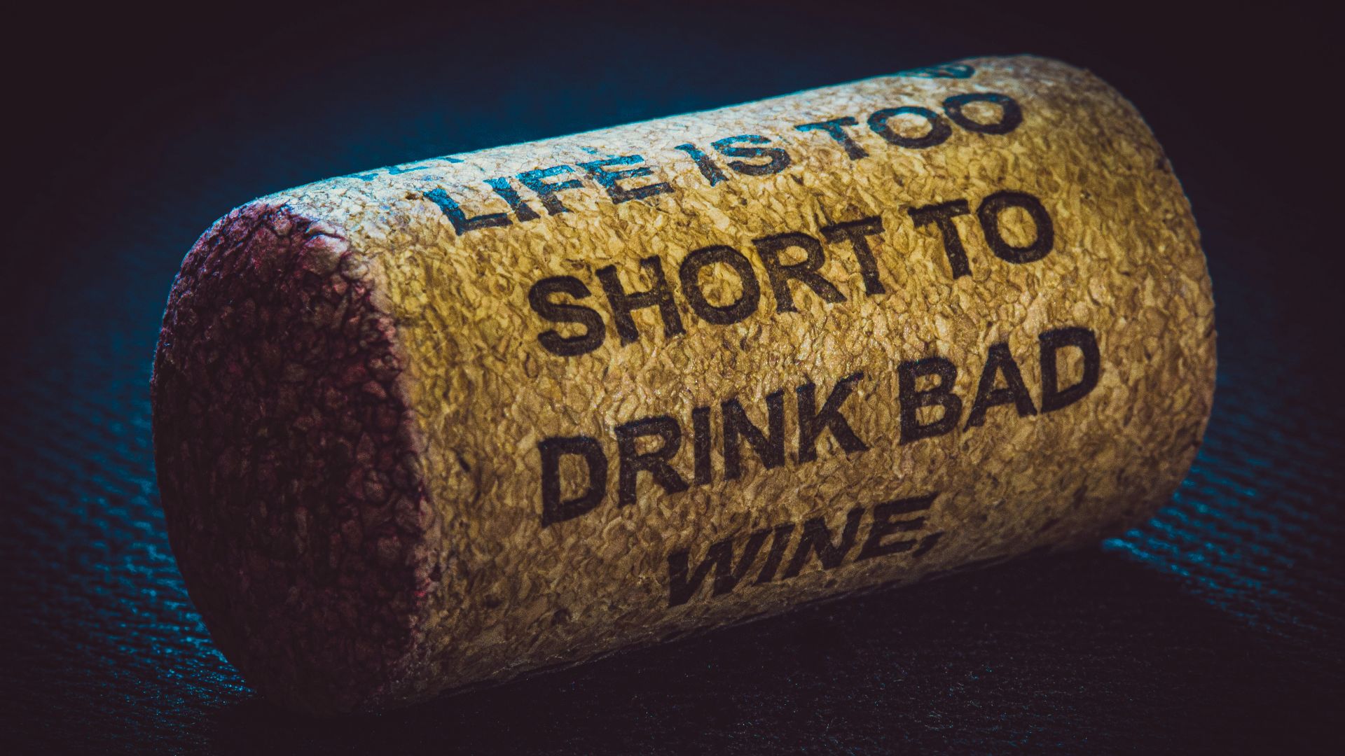 a cork with a message on it that says, life is too short to drink