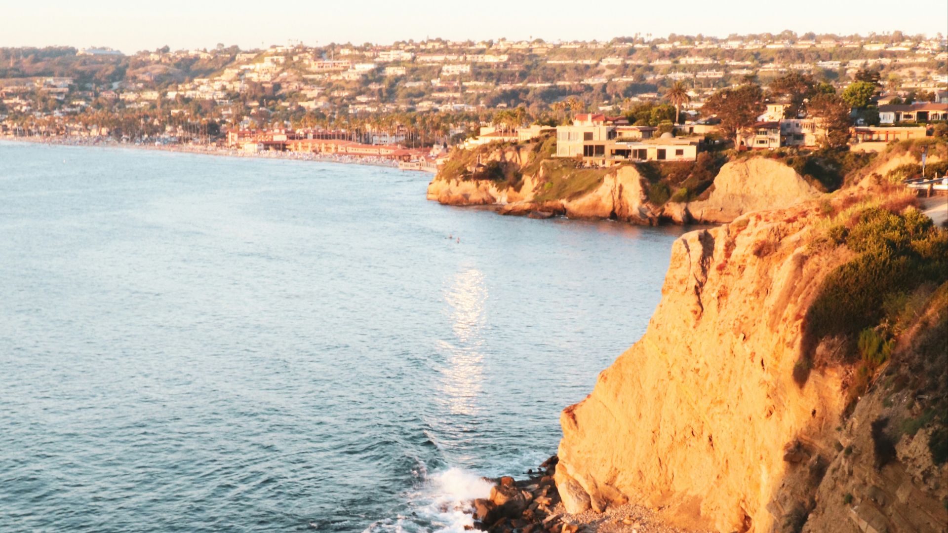 brown rock formation beside blue sea during daytime