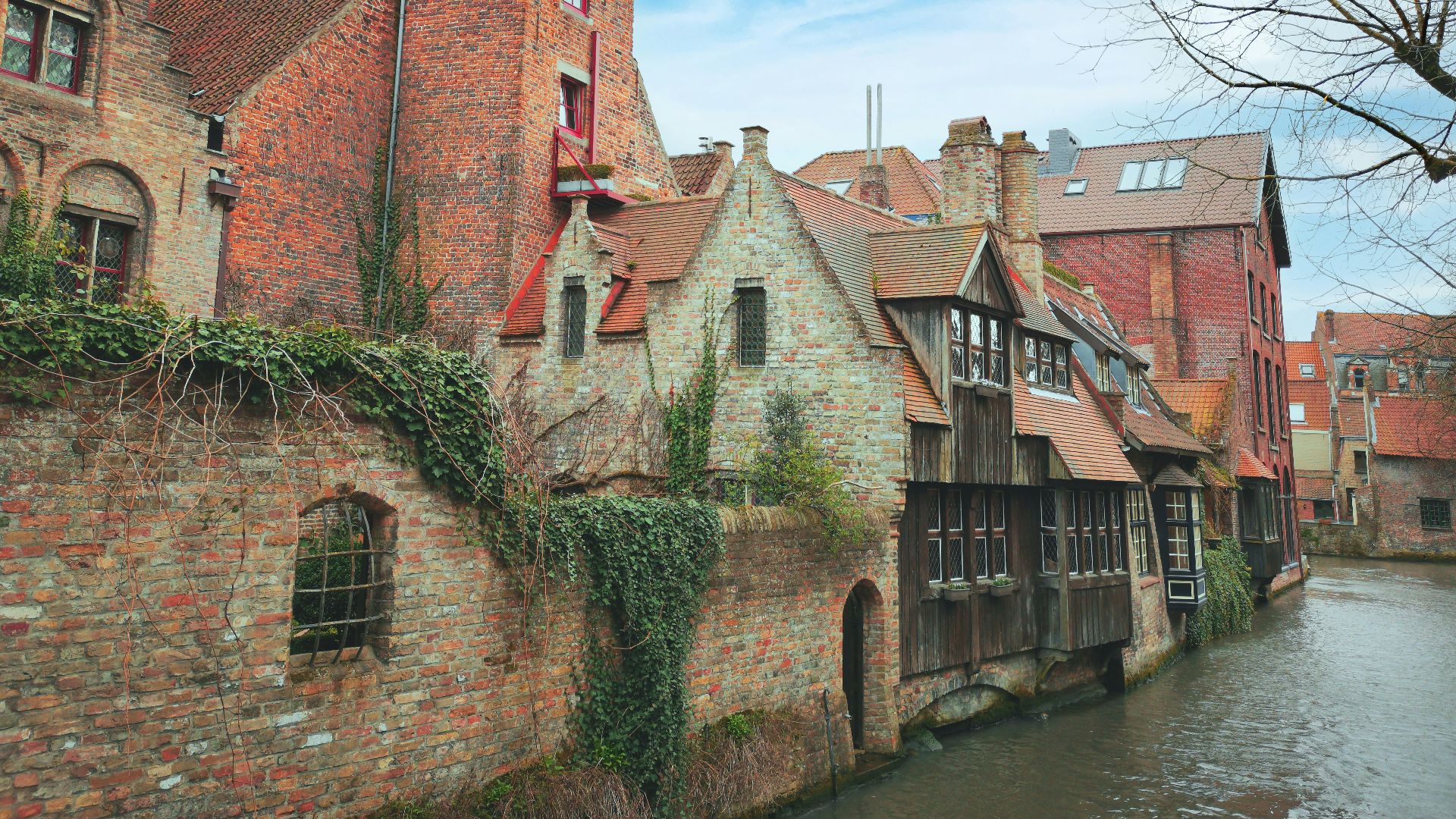 a river running through a city next to tall buildings
