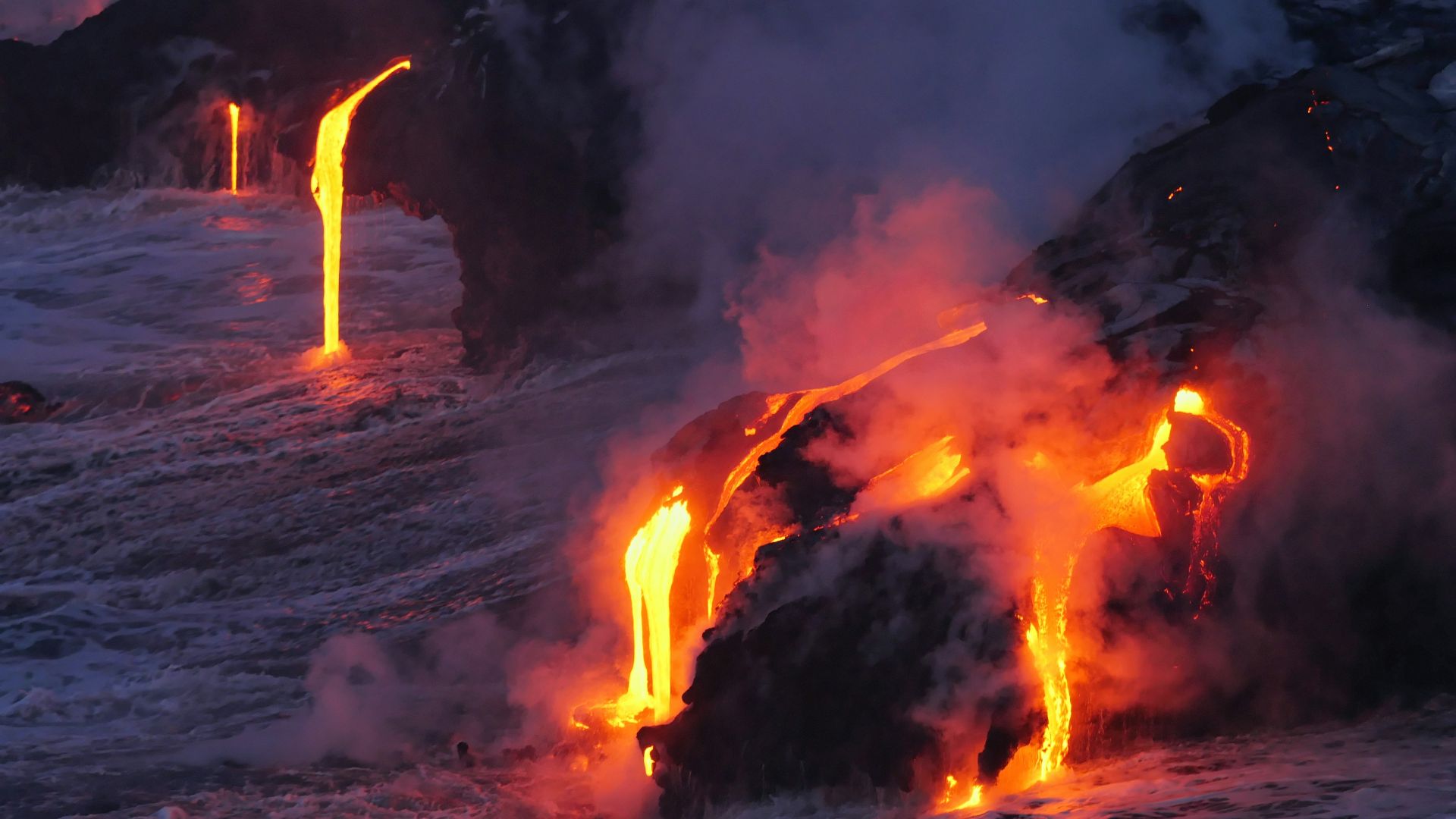 photo of lava flowing on land