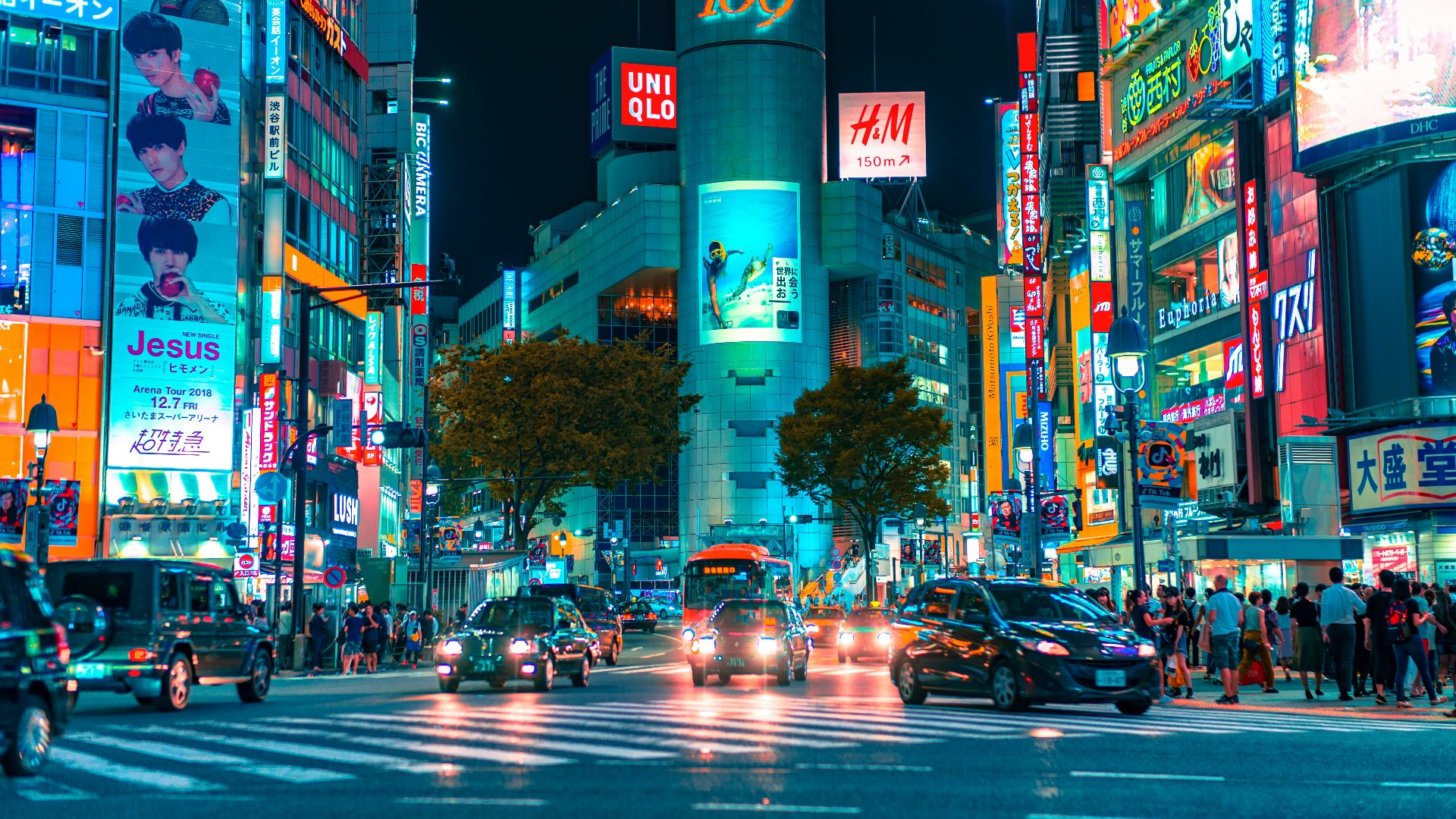 people gathered outside buildings and vehicles