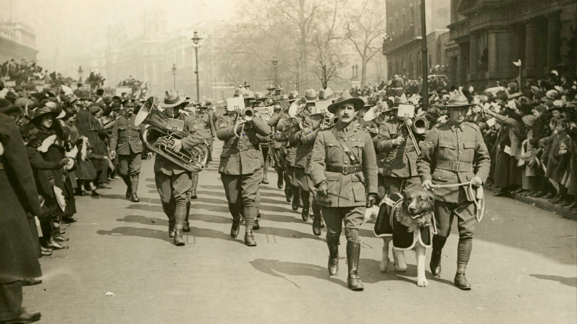 grayscale photography of soldier marching on road