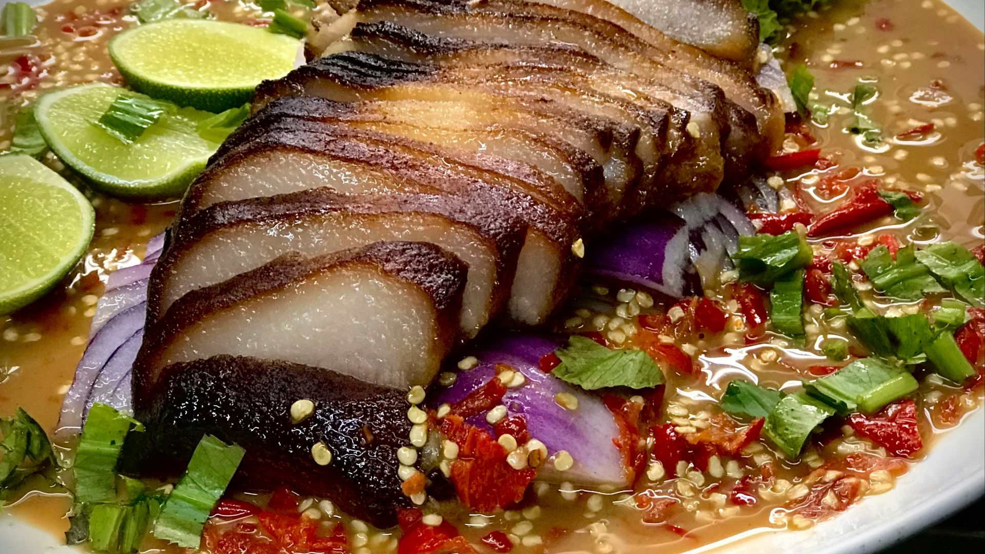 a white plate topped with meat and vegetables