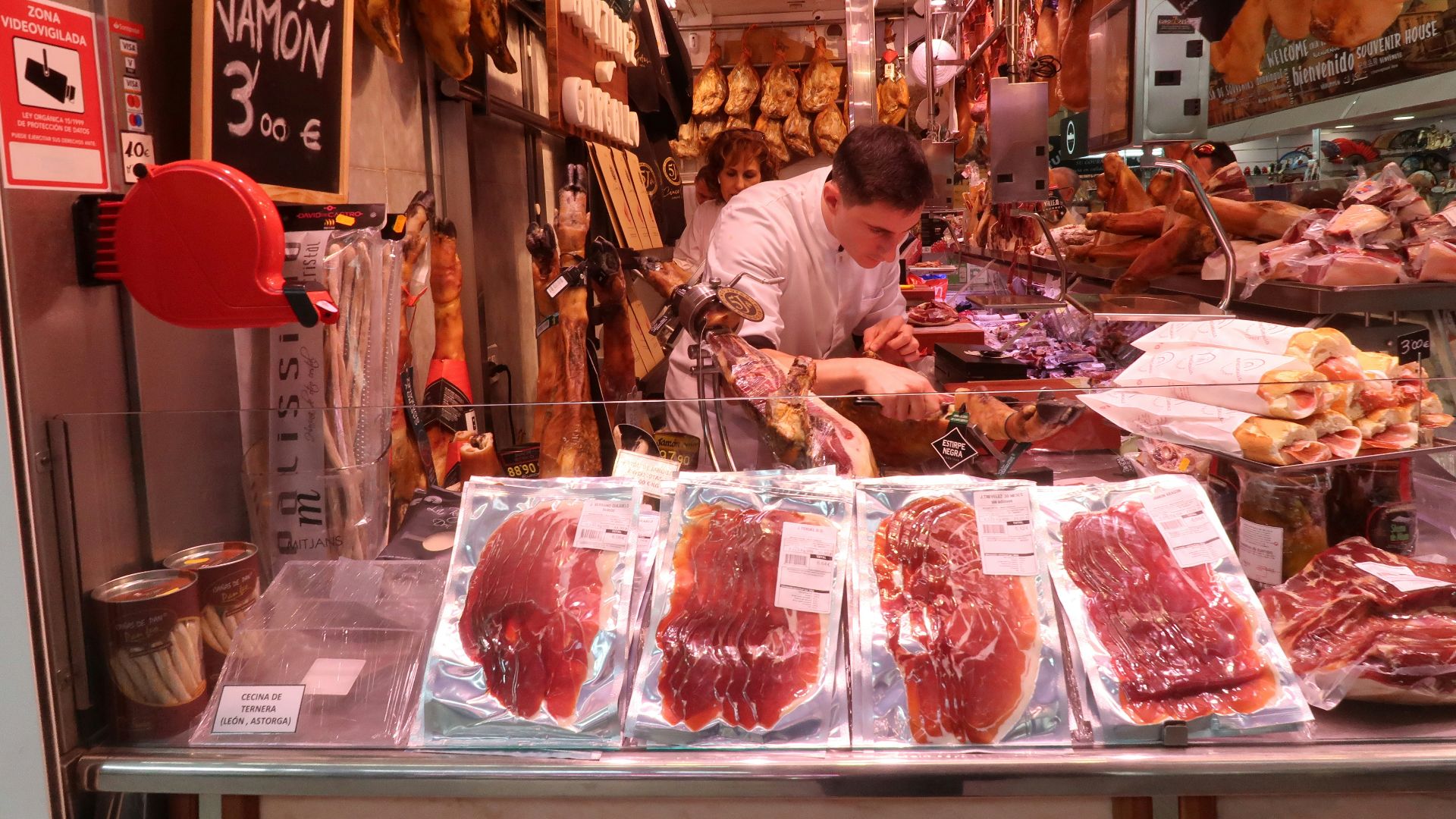 man slicing raw meat