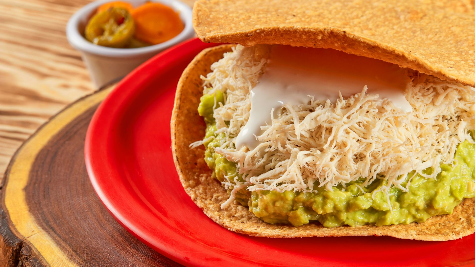 brown bread with green vegetable on red plate