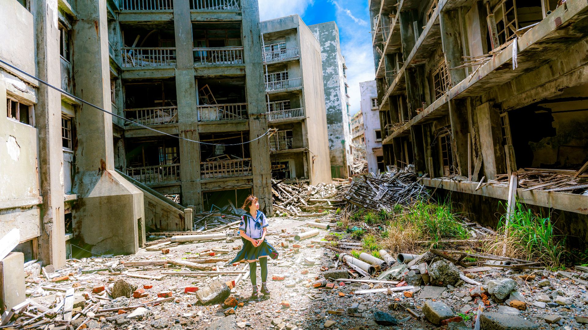 woman wearing white and green dress surrounded by storey buildings