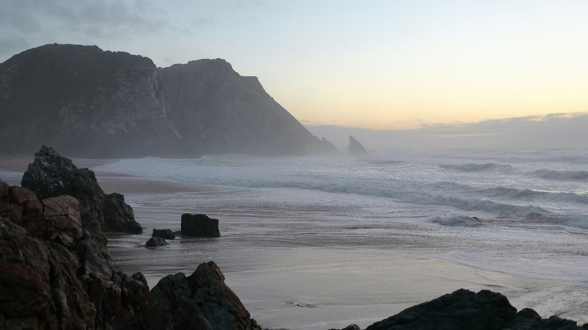 sea waves crashing on shore during daytime