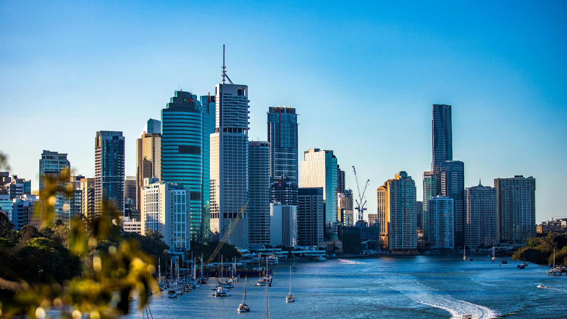 city skyline under clear blue sky during daytime