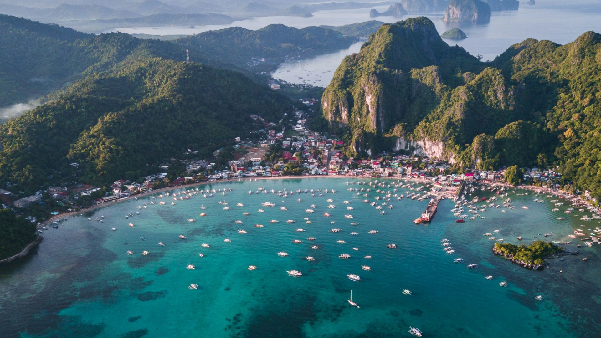 landscape photography of island with boats