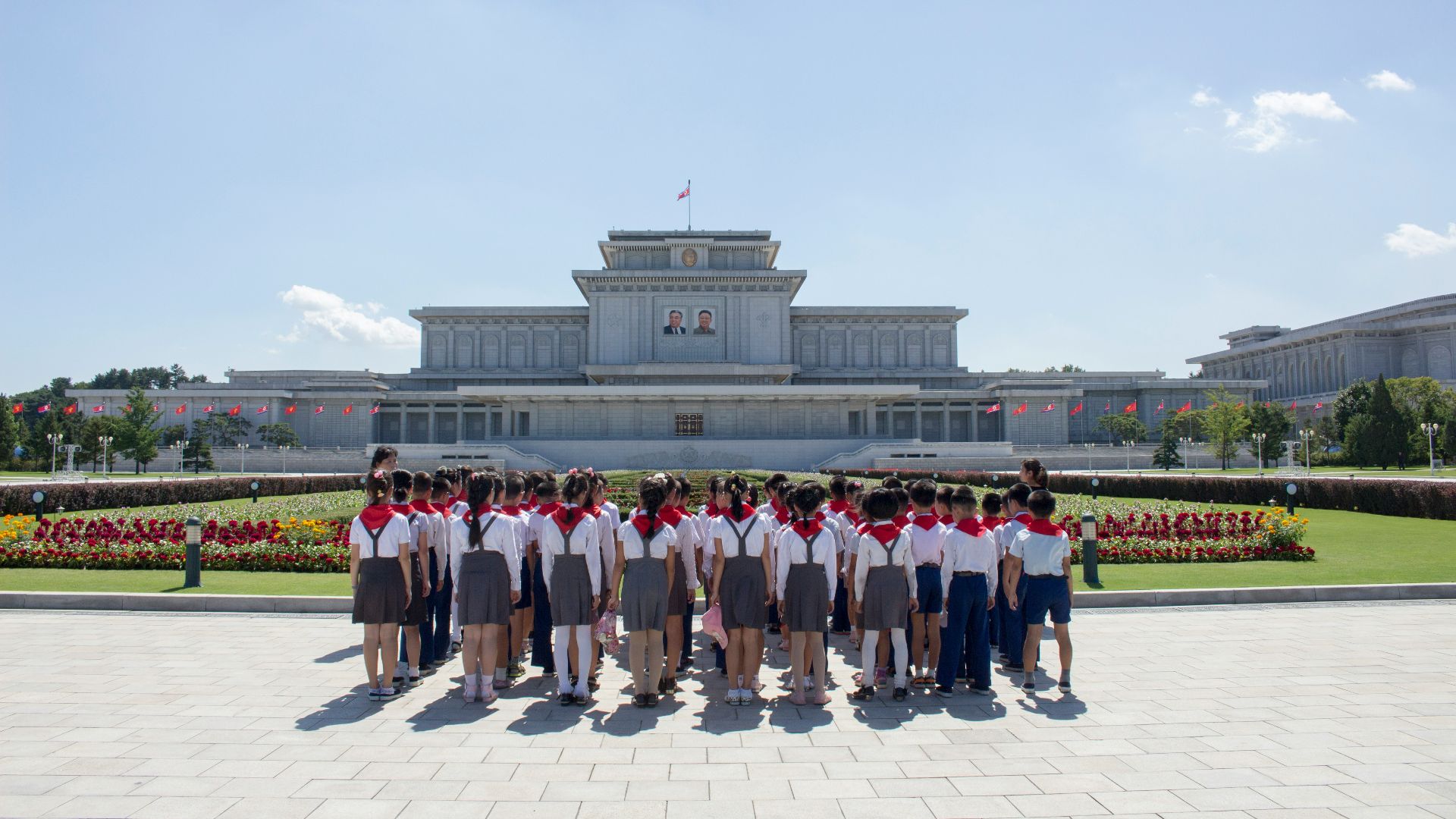 people standing on white concrete floor during daytime