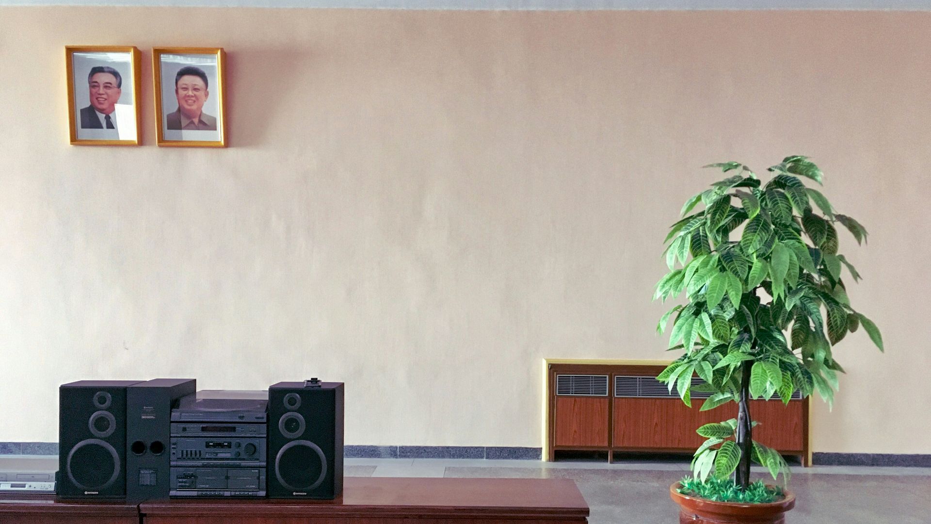 black stereo component on brown wooden table