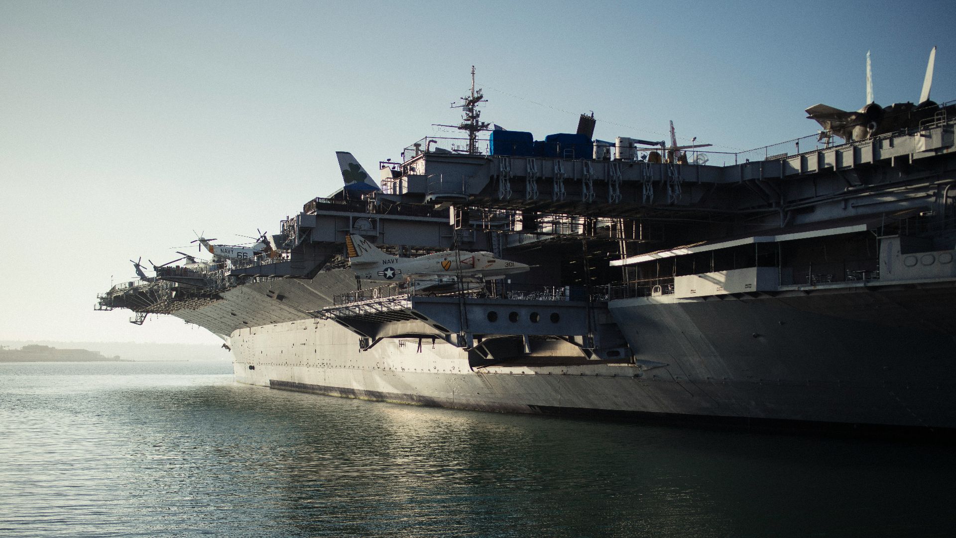 gray warship on body of water