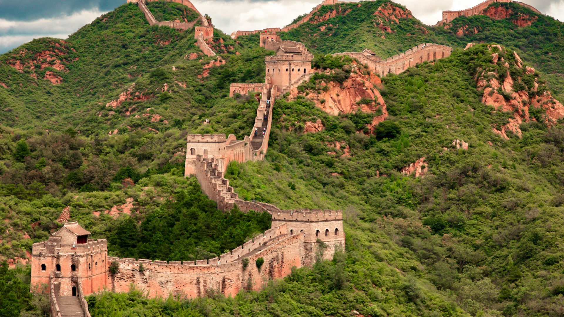 brown concrete building on top of hill