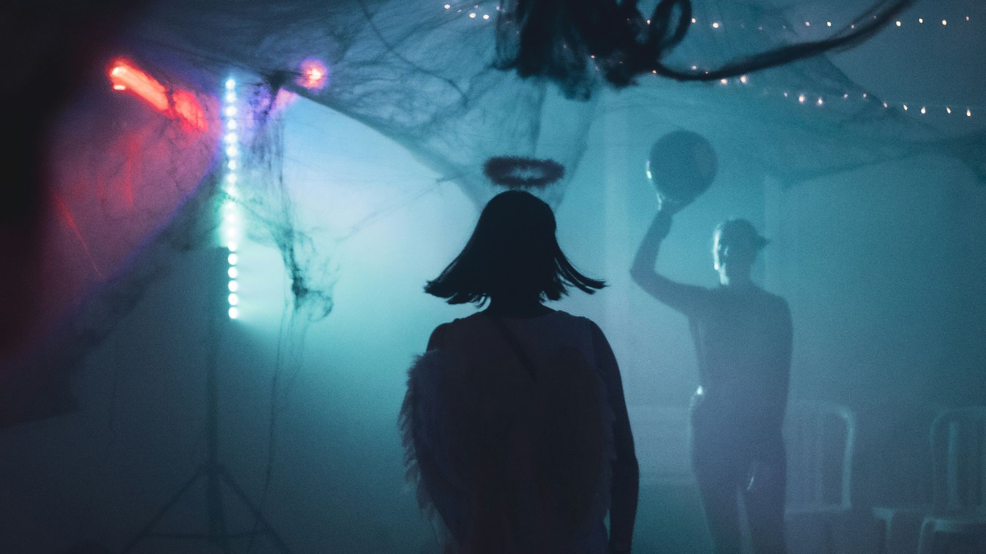 2 person inside a smoke covered room