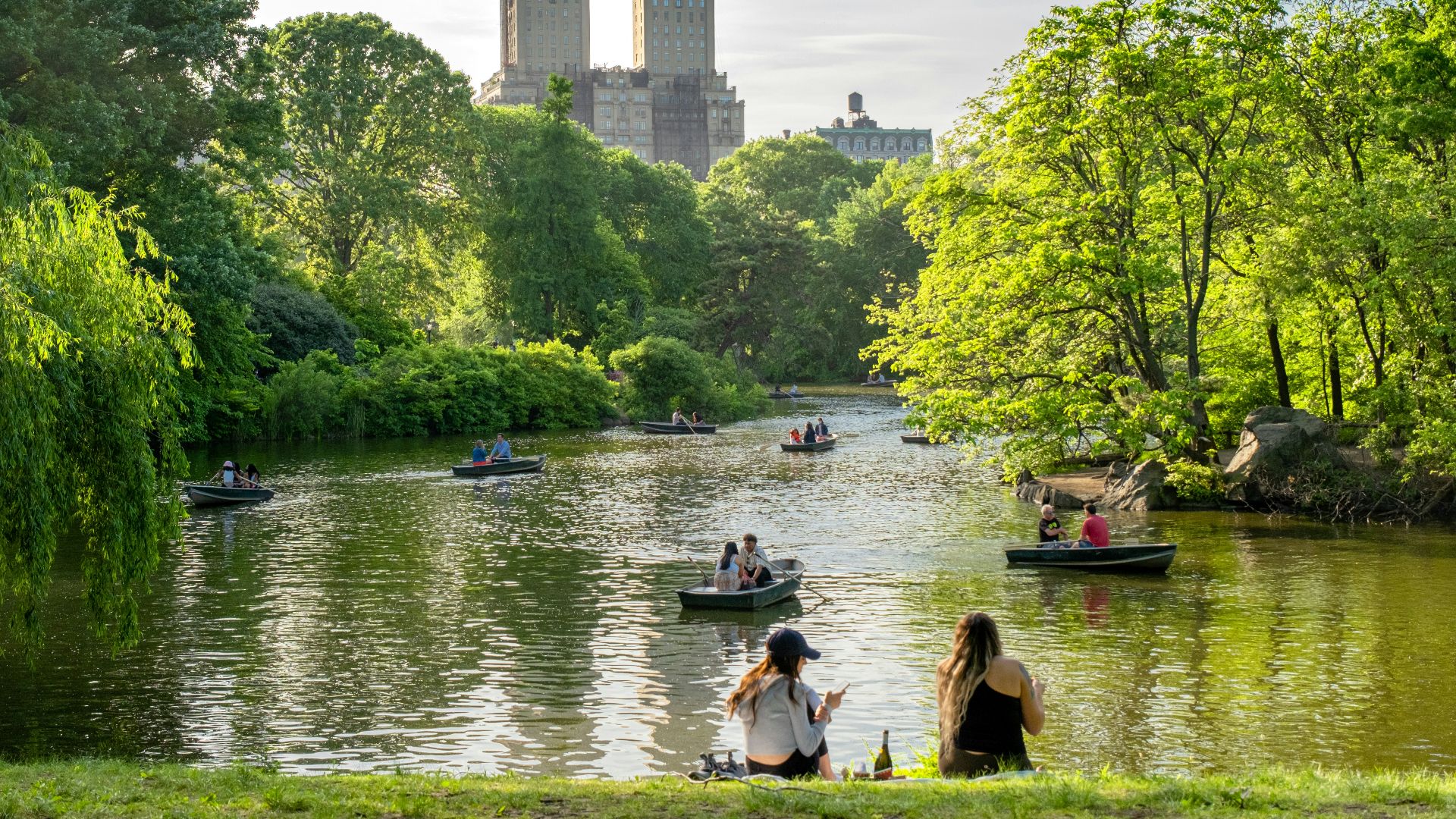 a group of people on small boats on a river
