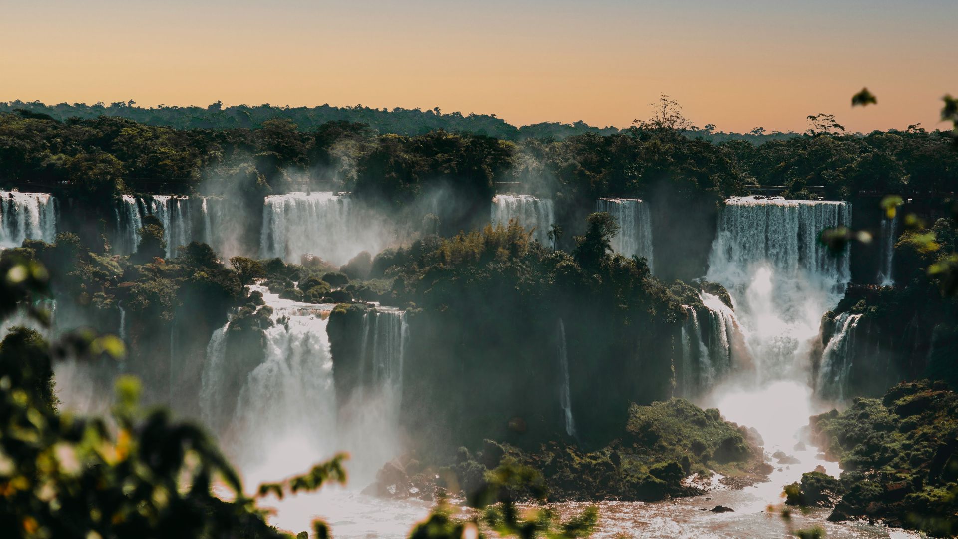 waterfalls under blue sky during daytime