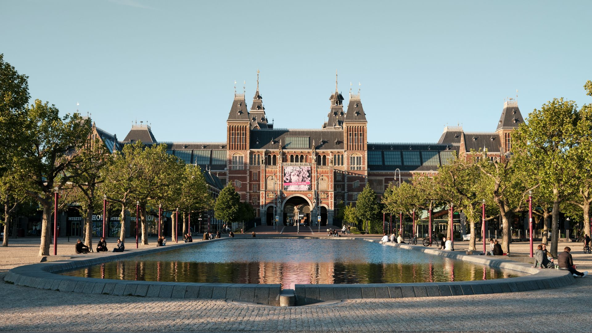 people walking on park near brown building during daytime