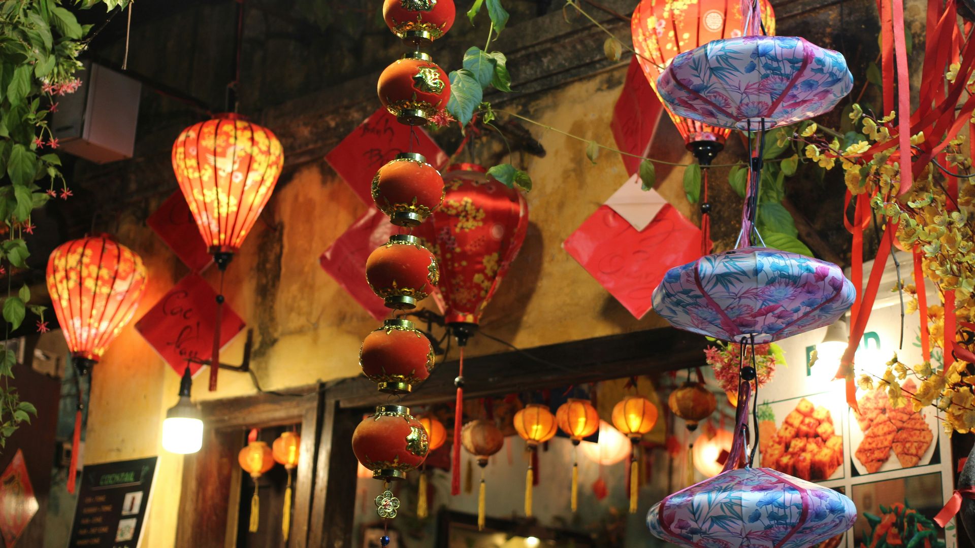 a number of lanterns hanging from a ceiling