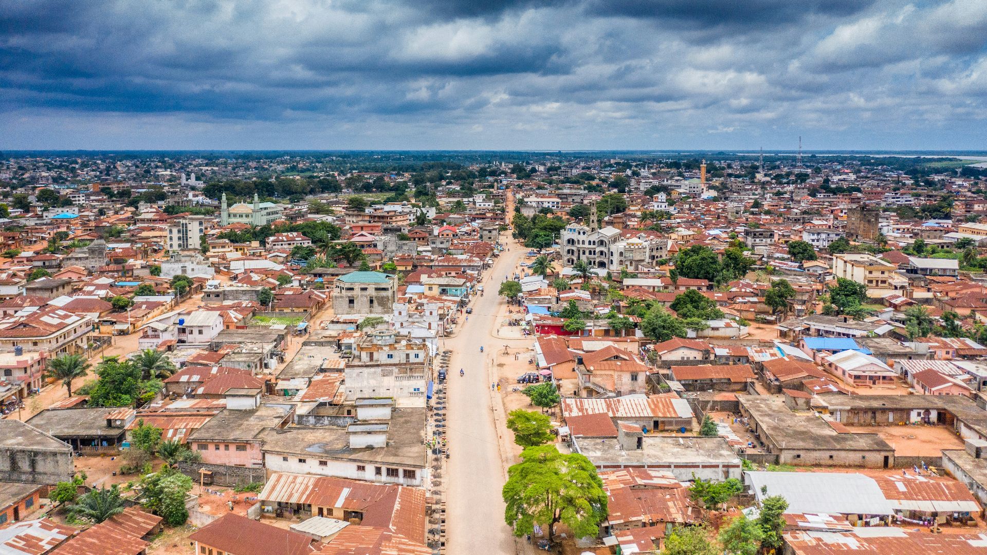 aerial view of city buildings under cloudy sky during daytime